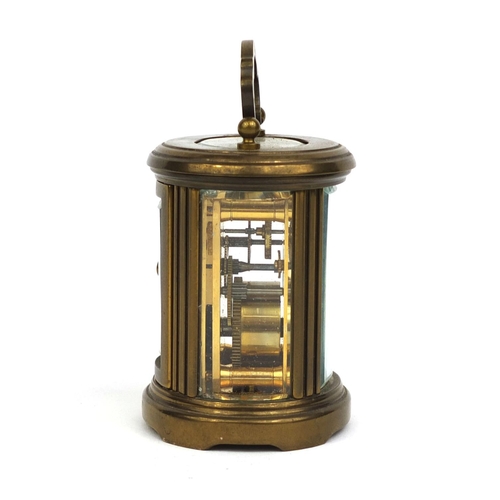 1102 - Matthew Norman of London oval brass cased carriage clock with bevelled glass and Roman numerals, 8cm... 