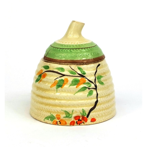 757 - Clarice Cliff honey pot and cover, factory marks to the base, 10cm high