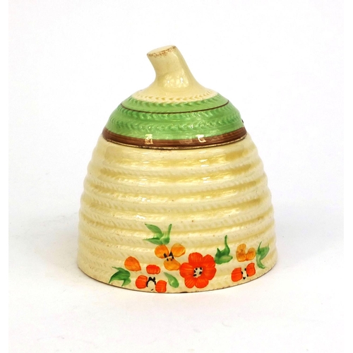 757 - Clarice Cliff honey pot and cover, factory marks to the base, 10cm high