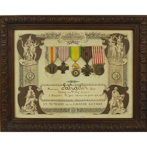 355 - Two framed displays of World War I French medals awarded to Caporal Coste Louis, each 39cm x 29cm ex... 