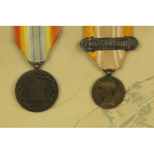 355 - Two framed displays of World War I French medals awarded to Caporal Coste Louis, each 39cm x 29cm ex... 