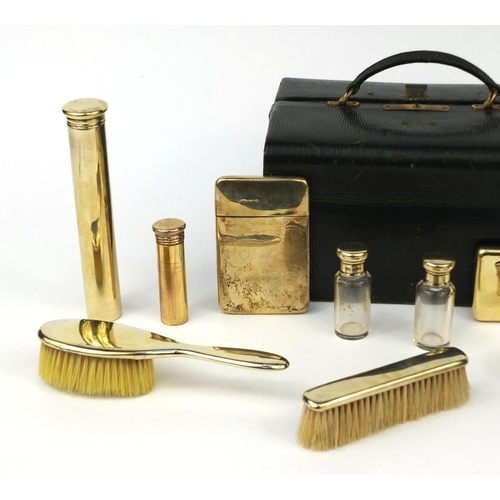 816 - Asprey London leather cased twelve piece vanity set, including a folding hand mirror, scent bottles,... 