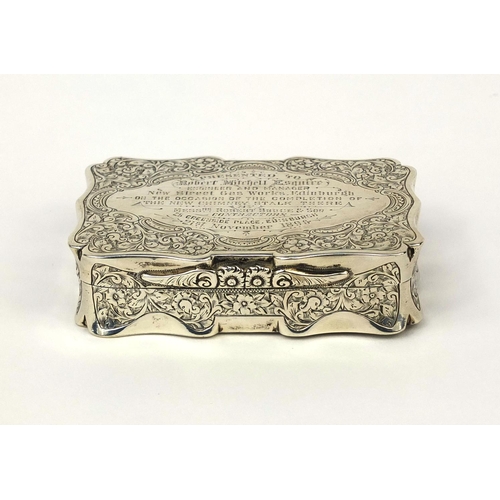 844 - Victorian rectangular silver snuff box with hinged lid and gilt interior, profusely engraved with fl... 