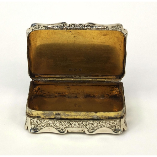 844 - Victorian rectangular silver snuff box with hinged lid and gilt interior, profusely engraved with fl... 