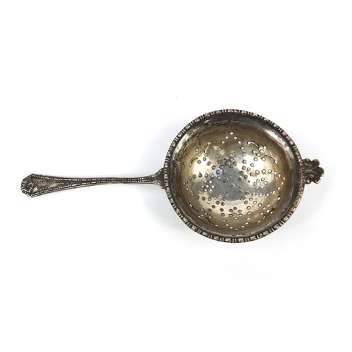 868 - Silver sifting spoon on stand, D.F London 1927, the spoon 15cm long, approximate weight 84.3g