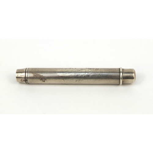 125 - S Mordan & Co silver pencil holder with engine turned decoration, London 1919, 8cm in length, approx... 