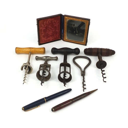 153 - Antique and later objects comprising five corkscrews, photograph of an elderly lady housed in a tool... 