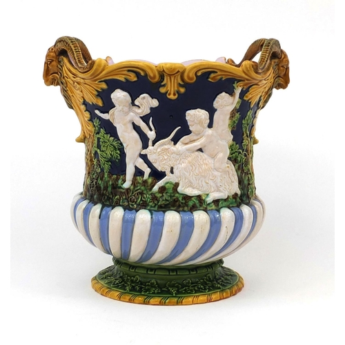 752 - Minton Majolica planter with twin ram head handles, decorated in relief with figures and rams, impre... 