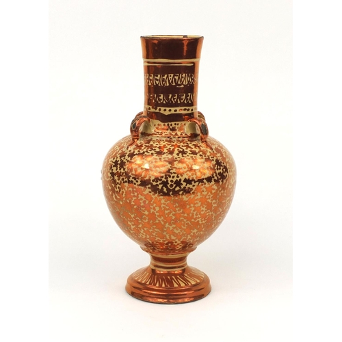618 - Middle Eastern Lustre pottery vase with four handles and stylised decoration, 32cm high