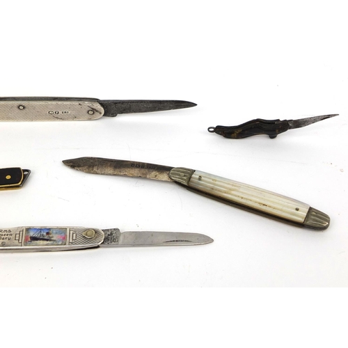 102 - Six vintage fruit and pocket knives including two silver flanked examples, one enamelled with RMS Qu... 