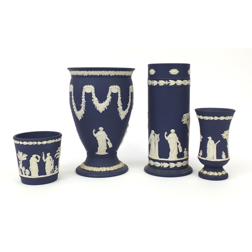 702 - Three Wedgwood Jasperware vases together with a Wedgwood Jasperware planter, each decorated in low r... 