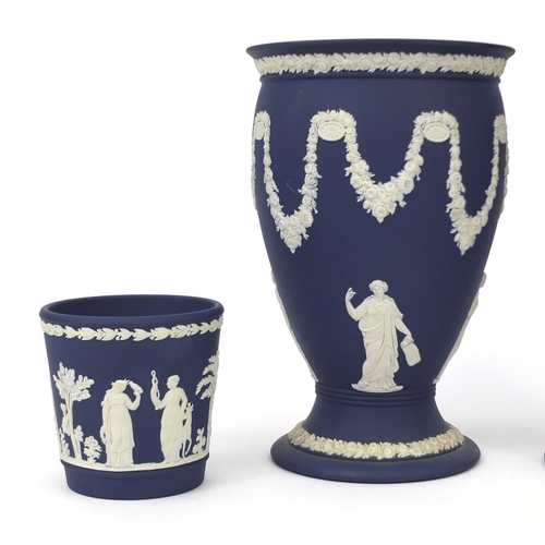 702 - Three Wedgwood Jasperware vases together with a Wedgwood Jasperware planter, each decorated in low r... 