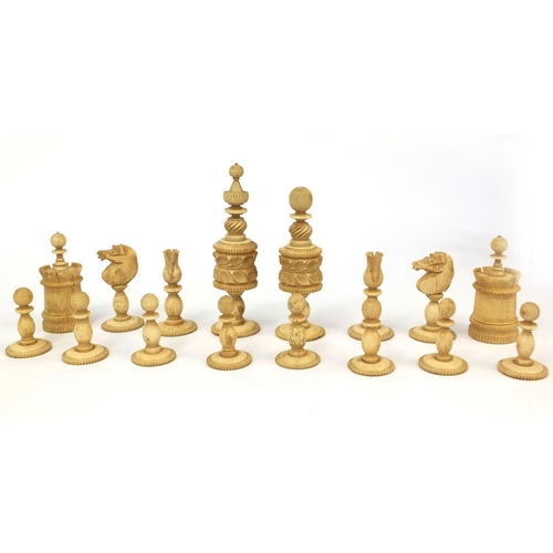 405 - Half stained turned bone chess set, the largest pieces 11cm high