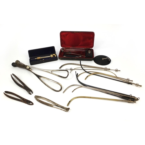 61 - Gynaecological instruments including forceps, ivory syringe housed in a velvet lined box, S Maw Son ... 