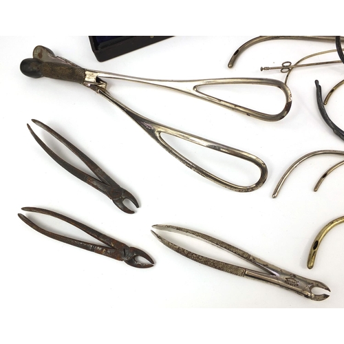 61 - Gynaecological instruments including forceps, ivory syringe housed in a velvet lined box, S Maw Son ... 