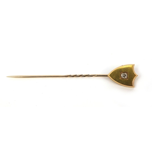 956 - Antique unmarked gold shield tie pin set with a solitaire diamond, approximate weight 3.6g housed in... 