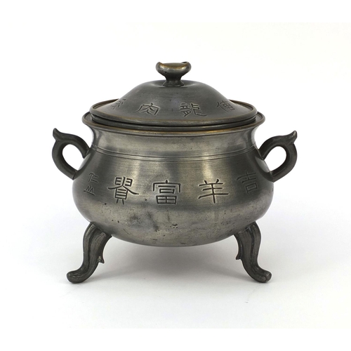 560 - Chinese Swatow pewter three footed censor and cover with twin handles, decorated with script, partia... 