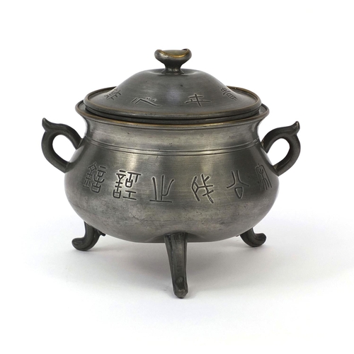 560 - Chinese Swatow pewter three footed censor and cover with twin handles, decorated with script, partia... 