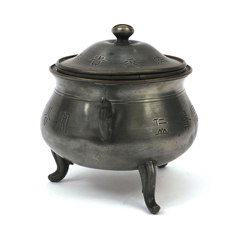 560 - Chinese Swatow pewter three footed censor and cover with twin handles, decorated with script, partia... 