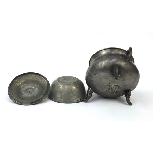 560 - Chinese Swatow pewter three footed censor and cover with twin handles, decorated with script, partia... 