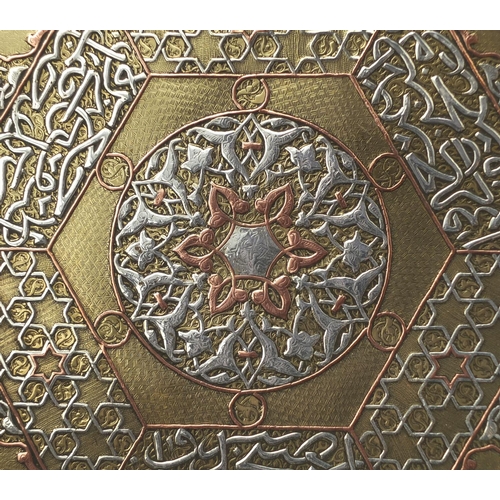 624 - Islamic Brass Cairoware tray inlaid with silver and copper script together with a Persian copper win... 