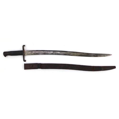 392 - Military interest bayonet and leather scabbard with wooden grip, 71cm in length
