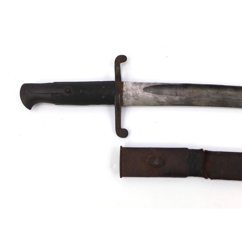 392 - Military interest bayonet and leather scabbard with wooden grip, 71cm in length