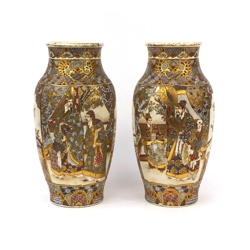 504 - Large pair of Japanese Satsuma pottery vases, hand painted and gilded with figures within foliate bo... 