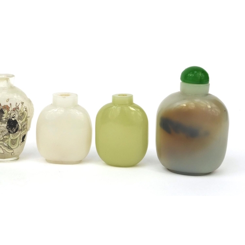 522 - Seven Chinese snuff bottles comprising six hard stone examples and an example reverse glass painted ... 