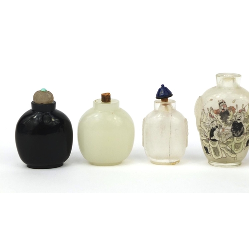 522 - Seven Chinese snuff bottles comprising six hard stone examples and an example reverse glass painted ... 