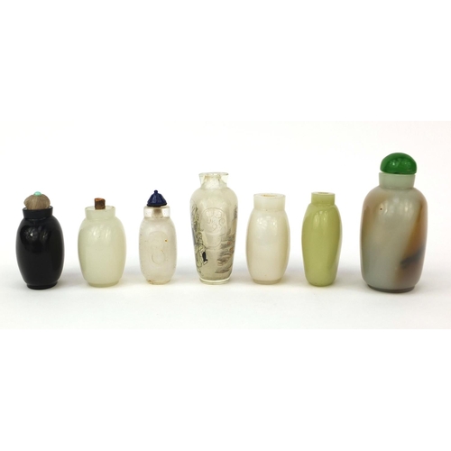 522 - Seven Chinese snuff bottles comprising six hard stone examples and an example reverse glass painted ... 