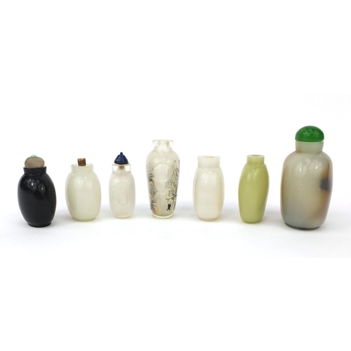 522 - Seven Chinese snuff bottles comprising six hard stone examples and an example reverse glass painted ... 