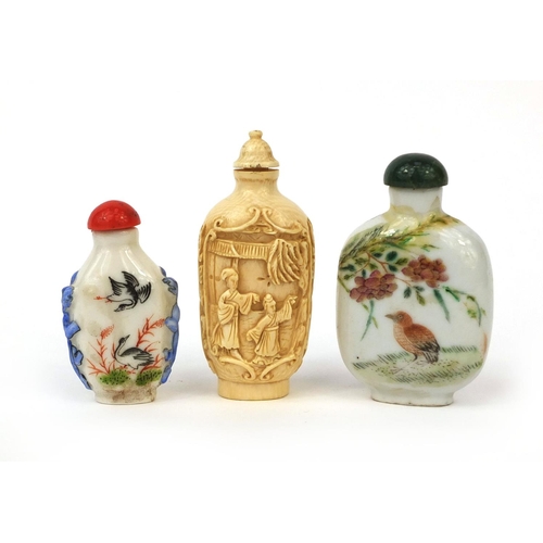 524 - Three Chinese snuff bottles comprising two porcelain examples, both hand painted with birds and one ... 