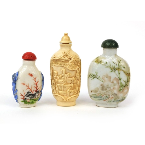 524 - Three Chinese snuff bottles comprising two porcelain examples, both hand painted with birds and one ... 