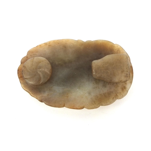 512 - Chinese russet coloured jade buckle, carved in the form of a Dog of Foo, 7cm wide