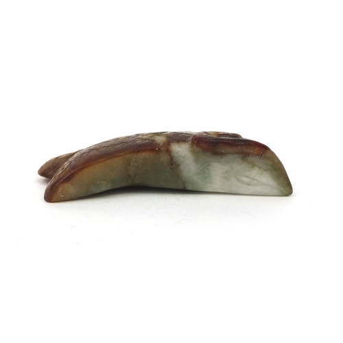 514 - Chinese carved jade pendant of naturalistic form with incised decoration, 7cm in length