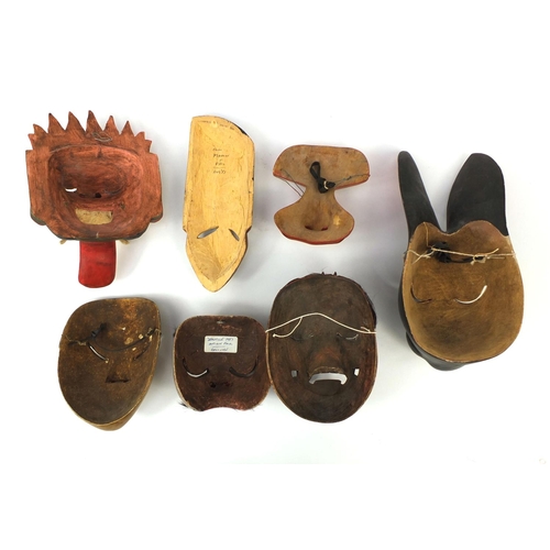 649 - Seven Balinese carved wooden face masks including examples in the form of a rabbit and a devil, the ... 