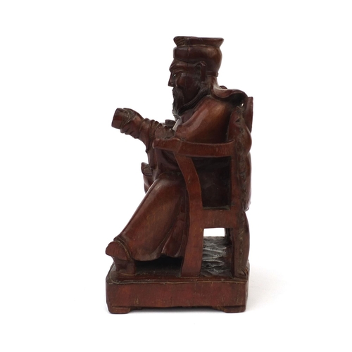 544 - Chinese root carving of a seated Emperor holding a scroll, 28cm high