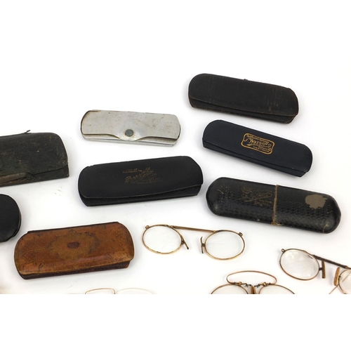 76 - Collection of vintage spectacles, mostly gold coloured metal examples, most with cases including a g... 