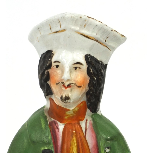 706 - Four 19th century Staffordshire pottery figures comprising Dick Turpin, Will Tell and his Son,  Esmo... 