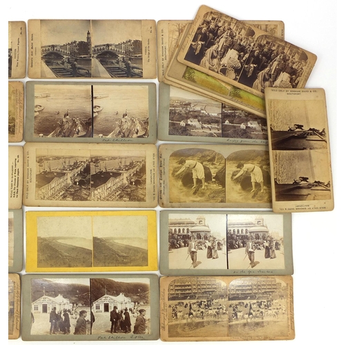 195 - Group of stereoscopic view cards and a stereoscopic card viewer, the cards including battleships and... 