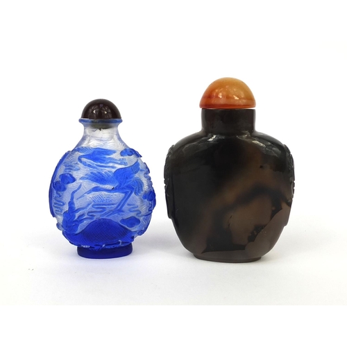 521 - Four Chinese hard stone and glass carvings and scent bottles, comprising a cameo glass scent bottle ... 