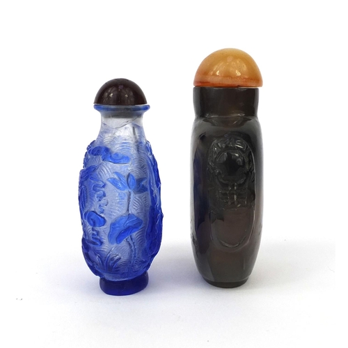 521 - Four Chinese hard stone and glass carvings and scent bottles, comprising a cameo glass scent bottle ... 