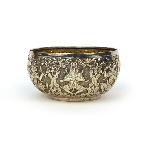 599 - Indian unmarked silver bowl, profusely embossed with mythical creatures amongst floral motifs, eleph... 