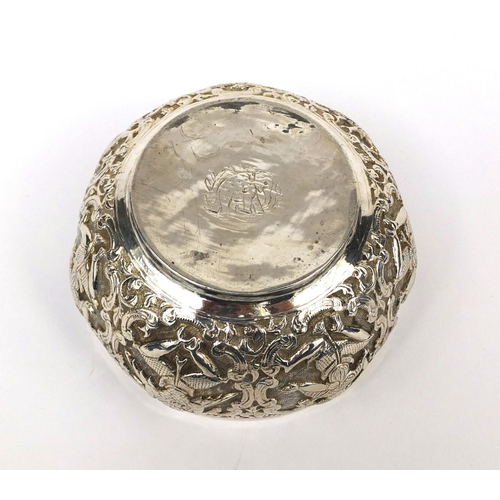 599 - Indian unmarked silver bowl, profusely embossed with mythical creatures amongst floral motifs, eleph... 