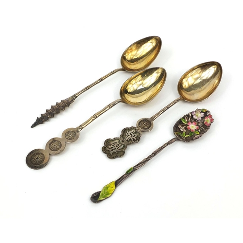 536 - Four Chinese silver spoons including an enamelled floral example, each with impressed character mark... 