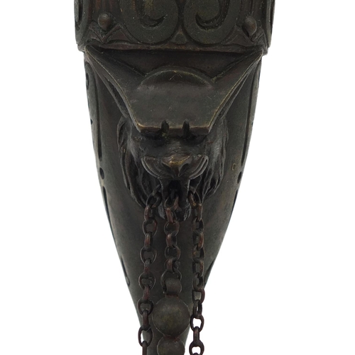 19 - Victorian bronze oil lamp with masks and lion paw feet, 25cm high
