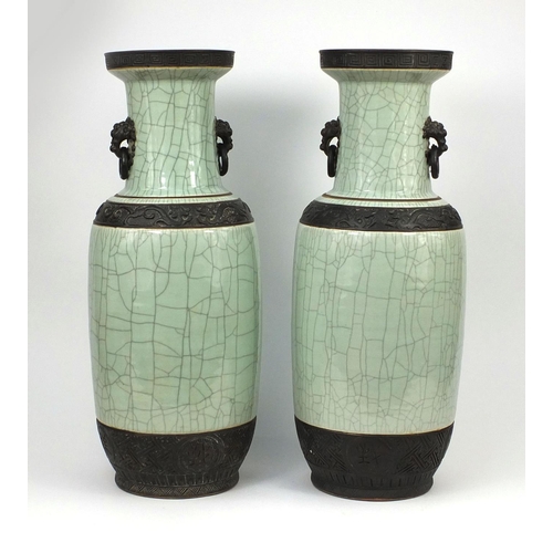 462 - Large pair of Chinese celadon crackle glazed vases, each with animalia ring handles and relief drago... 