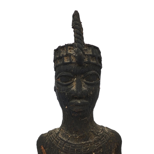 631 - African Benin style bronze tribesman, 26cm high