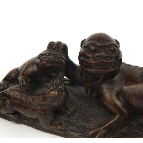 539 - Chinese wood carving of four water dragons together with a carved hardwood stand, the wood carving 1... 